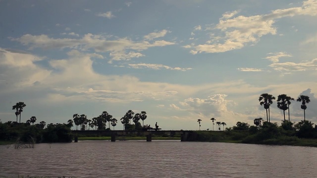 Video Reference: sky, cloud, waterway, water, river, horizon, reflection, bank, tree, evening