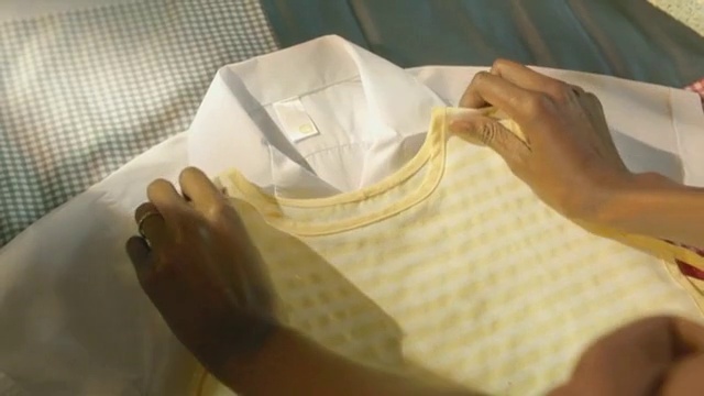 Video Reference: Hand, Paper, Pattern, Shirt, T-shirt, Pattern