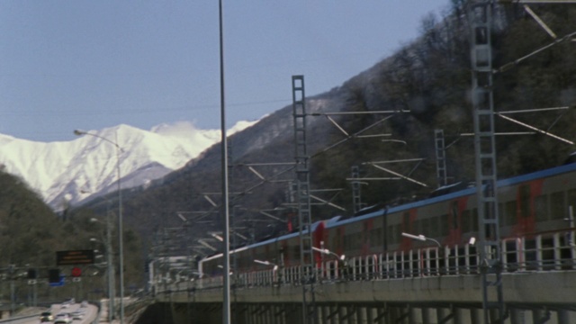 Video Reference: Mountainous landforms, Mountain range, Town, Transport, Hill station, Cable car, Mountain, Geological phenomenon, Residential area, Electricity