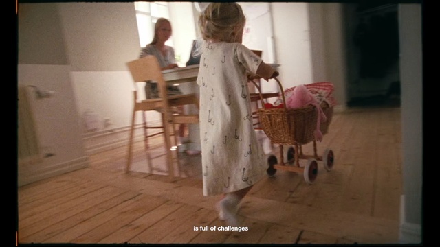 Video Reference: Product, Photograph, Floor, Dress, Snapshot, Flooring, Fashion, Room, Hardwood, Baby products, Indoor, Small, Building, Table, Sitting, Living, White, Dog, Little, Man, Standing, Holding, Woman, Kitchen, Wooden, Red, Bed, Furniture, Chair, Toddler, Baby, Clothing