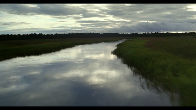 Video Reference: Water resources, Body of water, Natural landscape, Sky, Nature, Water, Reflection, River, Natural environment, Cloud, Grass, Outdoor, Clouds, Train, Cloudy, Traveling, View, Body, Pond, Large, Track, Field, Country, Smoke, Boat, Grassy, Standing, Bridge, Blue, Plane, Riding, Lake, Floodplain, Tree, Bank, Landscape, Reservoir, Tidal marsh, Day