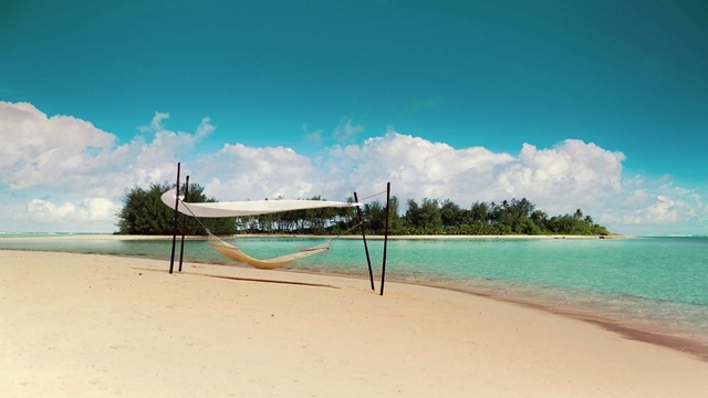 Video Reference: volleyball net, net, game equipment, beach, sand, equipment, sea, ocean, vacation, water, island, travel, coast, sky, landscape, shore, tropical, holiday, summer, sport, paradise, coastline, wave, Person