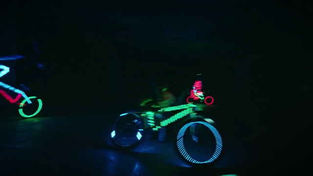 Video Reference: Green, Light, Bicycle wheel, Neon, Lighting, Bicycle accessory, Automotive lighting, Vehicle, Headlamp, Bicycle part