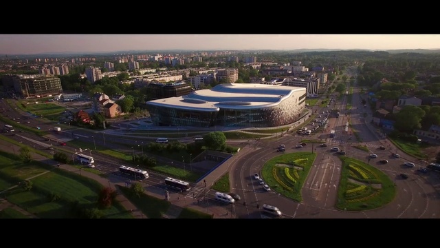 Video Reference: Aerial photography, Sport venue, Metropolitan area, Stadium, Urban area, Birds-eye view, City, Arena, Human settlement, Urban design