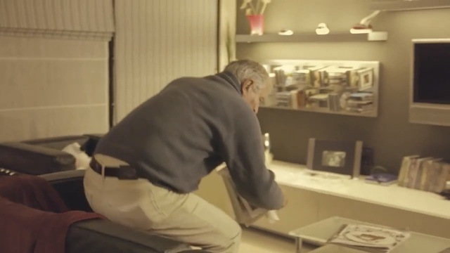 Video Reference: furniture, floor, flooring, interior design, Person