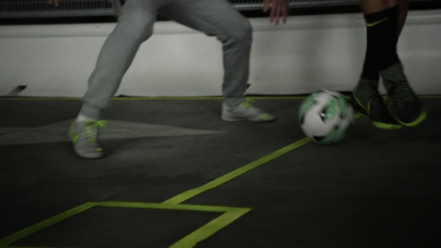 Video Reference: green, footwear, white, indoor games and sports, black, games, yellow, floor, sport venue, ball