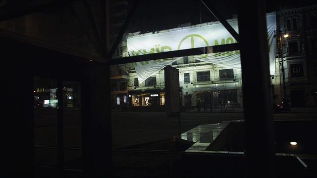 Video Reference: night, reflection, darkness, light, architecture, lighting, window, metropolitan area, tourist attraction, building, Person