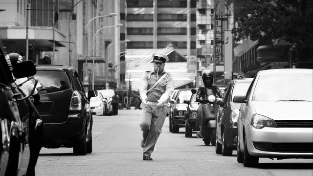 Video Reference: Vehicle, Urban area, Street, Car, Traffic, Snapshot, Pedestrian, Black-and-white, Road, City car