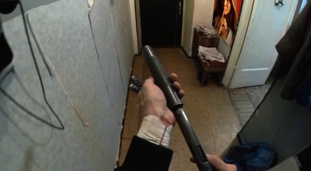 Video Reference: Firearm, Gun, Shotgun, Rifle, Hardwood, Gun barrel, Room, Wood, Airsoft gun, Tripod, Indoor, Sitting, Table, Computer, Man, Desk, Holding, Laptop, Young, Standing, White, Laying, Woman, Kitchen, Wooden, Living, Cat, Mouse, Board, Dog, Bedroom, Umbrella, Refrigerator, Playing, Bed, Floor, Weapon, Tool