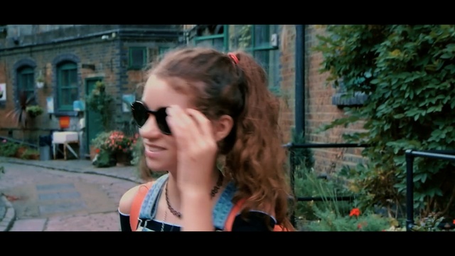 Video Reference: hair, glasses, blue, face, photograph, people, woman, facial expression, human hair color, smile, Person