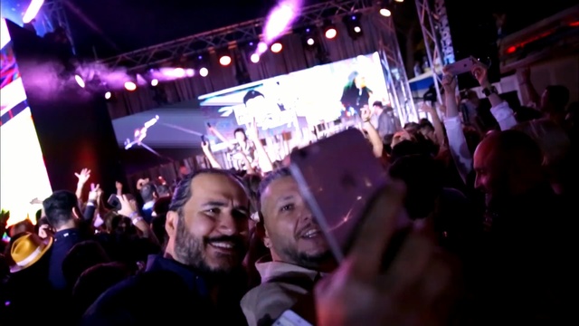 Video Reference: crowd, entertainment, audience, event, nightclub, disco, night, music venue, rave, fun, Person