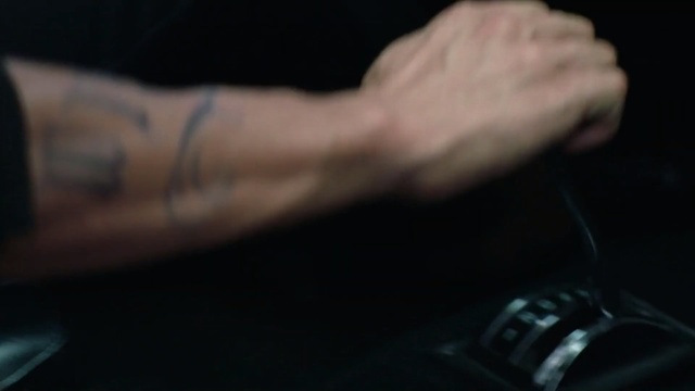 Video Reference: Tattoo, Arm, Wrist, Hand, Finger, Joint, Human leg, Elbow, Human body, Muscle, Indoor, Person, Remote, Holding, Sitting, Man, Computer, Video, Table, Control, Game, White, Black, Keyboard, Television, Someone, Close, Young, Desk, Standing, Playing, Food, Laying, Cat, Watch