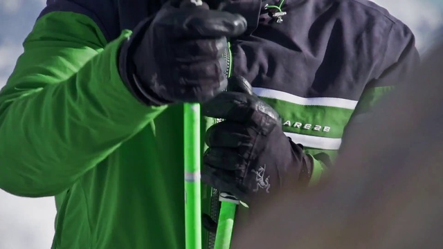 Video Reference: Green, Jacket, Outerwear, Sleeve, Personal protective equipment, T-shirt, Arm, Hoodie, Top, Glove