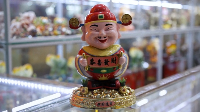 Video Reference: Toy, Figurine, Souvenir, Action figure, Smile