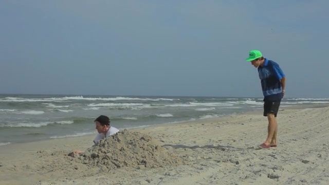 Video Reference: Beach, Shore, Sand, Coast, Natural environment, Vacation, Fun, Ocean, Sea, Coastal and oceanic landforms, Person