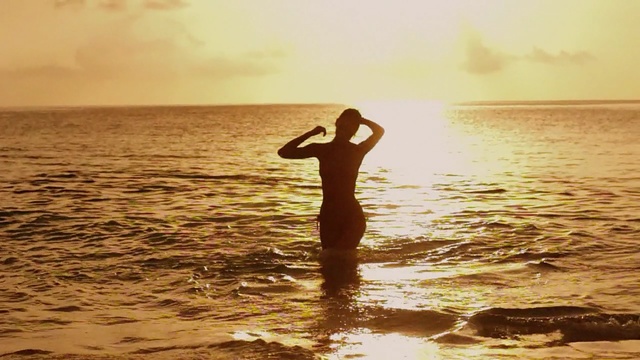 Video Reference: sea, water, horizon, sky, ocean, shore, calm, summer, sunlight, sun, Person