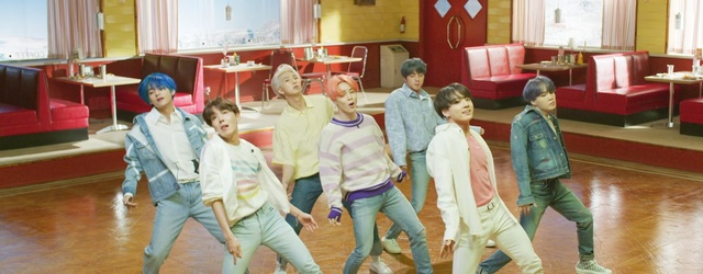 Video Reference: Event, Child, Fun, Room, Kindergarten, Performance, Leisure, Dance, Person, Indoor, Group, Playing, Young, Game, Man, Holding, Woman, Court, People, Standing, Player, Table, Soccer, Ball, Clothing, Floor, Smile, Human face, Sport, Boy