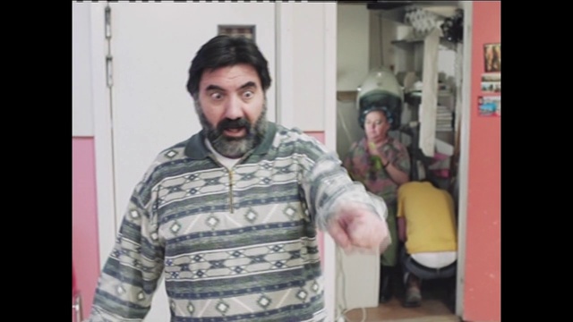 Video Reference: Facial expression, People, Cool, Moustache, Cheek, Forehead, Facial hair, Human, Beard, Mouth, Person, Man, Indoor, Standing, Holding, Front, Shirt, Table, Refrigerator, Snow, Room, White, Human face, Clothing, Text, Smile