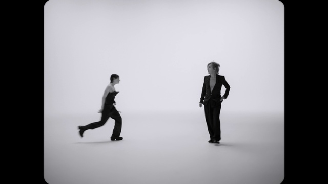 Video Reference: Flash photography, Sleeve, Gesture, Style, Black-and-white, Rectangle, Font, Art, Technology, Monochrome photography