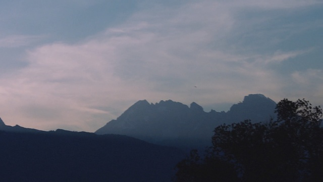 Video Reference: sky, mountainous landforms, mountain range, mountain, cloud, highland, ridge, atmosphere, morning, tree