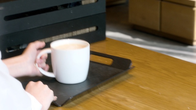 Video Reference: Cup, Cup, Coffee cup, Drinkware, Mug, Table, Hardwood, Tableware, Wood, Floor