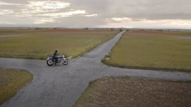 Video Reference: road, mode of transport, field, asphalt, plain, ecoregion, vehicle, steppe, grass, grassland