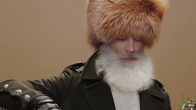 Video Reference: Hair, Fur, Facial hair, Fur clothing, Beard, Moustache, Headgear, Cap, Coat, Jacket