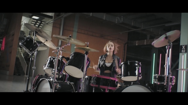 Video Reference: drum, drummer, drums, musical instrument, percussion, bass drum, musician, performance, stage, song, Person