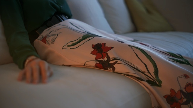 Video Reference: Arm, Leg, Textile, Plant, Hand, Room, Flesh, Flower, Linens, Bed, Indoor, Sitting, Small, Laying, Little, Laptop, Young, White, Table, Girl, Woman, Made, Lying, Baby, Blanket, Computer, Bear, Stuffed, Drawing, Bedclothes