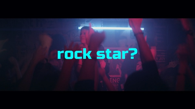 Video Reference: darkness, event, nightclub, song, stage, screenshot, computer wallpaper, magenta, neon, rave, Person