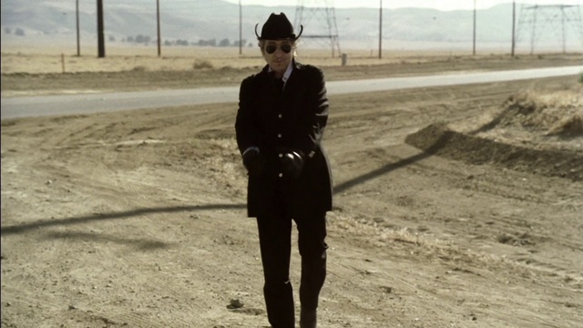 Video Reference: Standing, Snapshot, Fashion, Street fashion, Photography, Footwear, Headgear, Black-and-white, Outerwear, Jacket