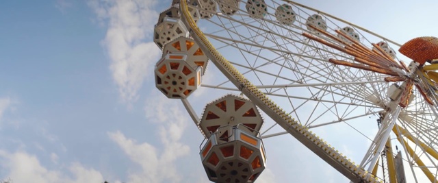 Video Reference: Ferris wheel, Amusement ride, Tourist attraction, Amusement park, Recreation, Fair, Nonbuilding structure