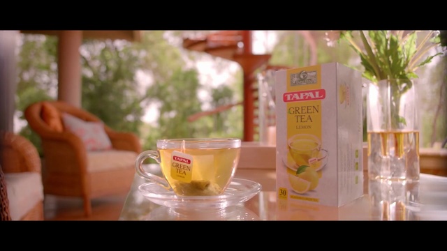 Video Reference: Drink, Food, Juice, Table, Sitting, Small, Water, Glass, Woman, Man, Little, Standing, Girl, Cake, Laptop, Pink, Young, Dog, Holding, Room, Sandwich, People, Red, Vase, White, Phone, Group, Soft drink, Tableware, Cocktail, Coffee, Cup, Beverage