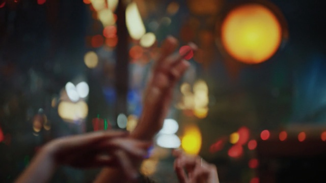 Video Reference: Red, Light, Night, Sky, Lighting, Hand, Tree, Finger, Photography, City, Person, Indoor, Table, Sitting, Phone, Cellphone, Photo, Woman, Food, Girl, Blurry, Glass, Holding, Glasses, Restaurant, Talking, Cake, Young, Pizza, White, Man, Blur