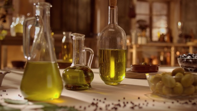 Video Reference: Glass bottle, Alcohol, Vegetable oil, Yellow, Liqueur, Bottle, Drink, Cooking oil, Glass, Olive oil