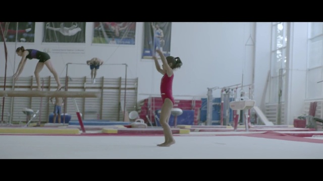 Video Reference: gymnastics, sports, sport venue, player, balance beam, performance, artistic gymnastics, fun, competition event, rhythmic gymnastics, Person