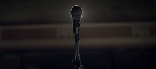 Video Reference: Microphone, Microphone stand, Audio equipment, Technology, Audio accessory, Electronic device, Photography, Still life photography, Darkness