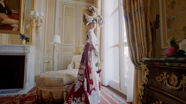 Video Reference: Room, Interior design, Furniture, Dress, Curtain, Textile, House, Wedding dress, Bridal clothing, Building