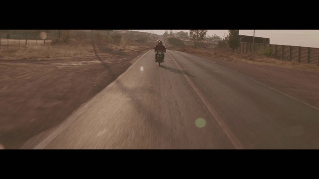 Video Reference: Road, Asphalt, Mode of transport, Atmospheric phenomenon, Lane, Morning, Road surface, Tree, Infrastructure, Longboard