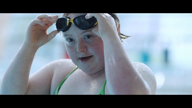 Video Reference: goggles, bathing cap, cap, headdress, portrait, water, adult, face, happy, people, Person