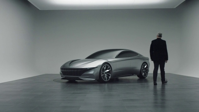 Video Reference: Automotive design, Vehicle, Car, Sports car, Concept car, Supercar, Luxury vehicle, Performance car, Executive car, Person, Indoor, Man, Standing, Table, Small, Front, Holding, Black, Desk, Sitting, Woman, Luggage, Young, Parked, Computer, Plane, Room, White, Suitcase, Board, Airplane, Floor, Automotive, Land vehicle, Wheel