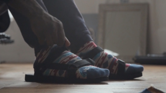 Video Reference: footwear, shoe, leg, ankle, outdoor shoe, flooring, floor, foot, human leg