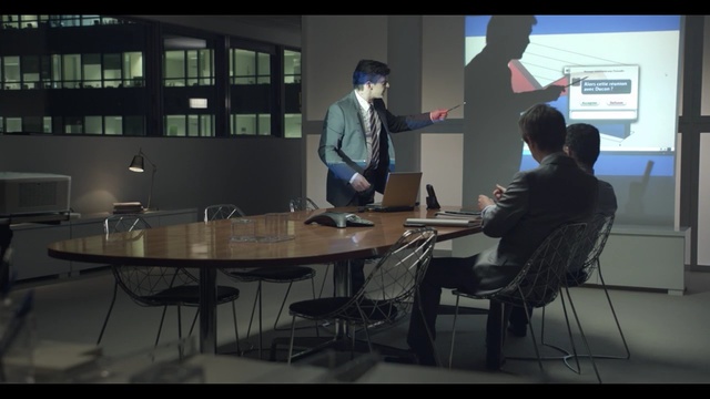 Video Reference: Snapshot, Conversation, Room, Screenshot, Table, Photography, Sitting, Furniture, Desk