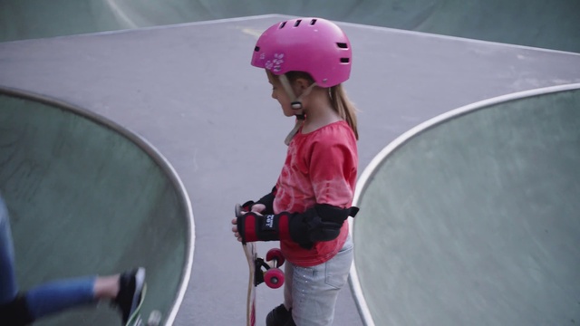Video Reference: Pink, Helmet, Footwear, Sports equipment, Recreation, Headgear, Vehicle, Sport venue, Roller sport, Sports, Person