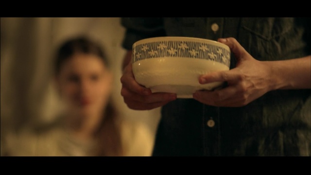 Video Reference: game equipment, rugby ball, punching bag, ball, equipment, man, beer glass, container, hand, Person