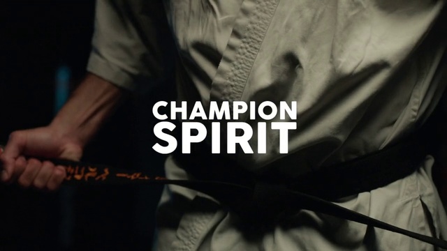 Video Reference: Font, Music, T-shirt, Hand, Photography, Shoe, Person, Man, Holding, Photo, Black, Wearing, Shirt, White, Woman, Hat, Player, Standing, Playing, Text, Screenshot, Clothing, Poster, Male