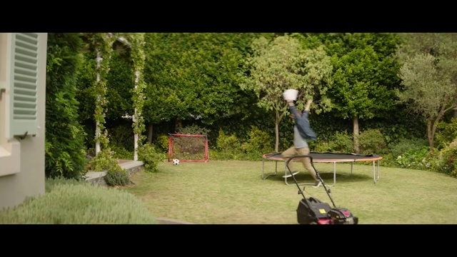 Video Reference: Nature, Lawn, Grass, Tree, Shrub, Vehicle, Fun, Kick scooter, Leisure, Plant, Outdoor, Man, Small, Playing, Woman, Holding, Young, Riding, Boy, Standing, Jumping, Wearing, Air, Park, Dog, Red, Board, White, Game, Street, Trick, Doing, Living, Field, Room, Flying, Video, Bench, Playground, Chair, Furniture
