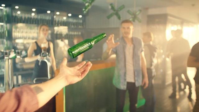 Video Reference: green, drink, fun, event, glass, alcohol, distilled beverage, Person