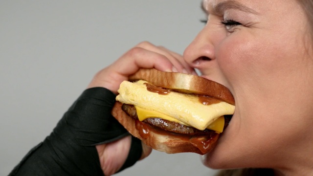 Video Reference: junk food, fast food, eating, hamburger, food, breakfast sandwich, mouth, cheeseburger, sandwich, finger food