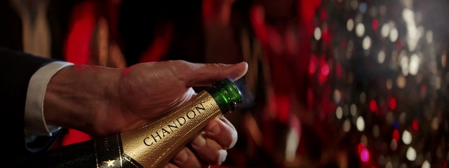 Video Reference: drink, alcoholic beverage, alcohol, hand, arm, distilled beverage, champagne, finger, bottle, liqueur